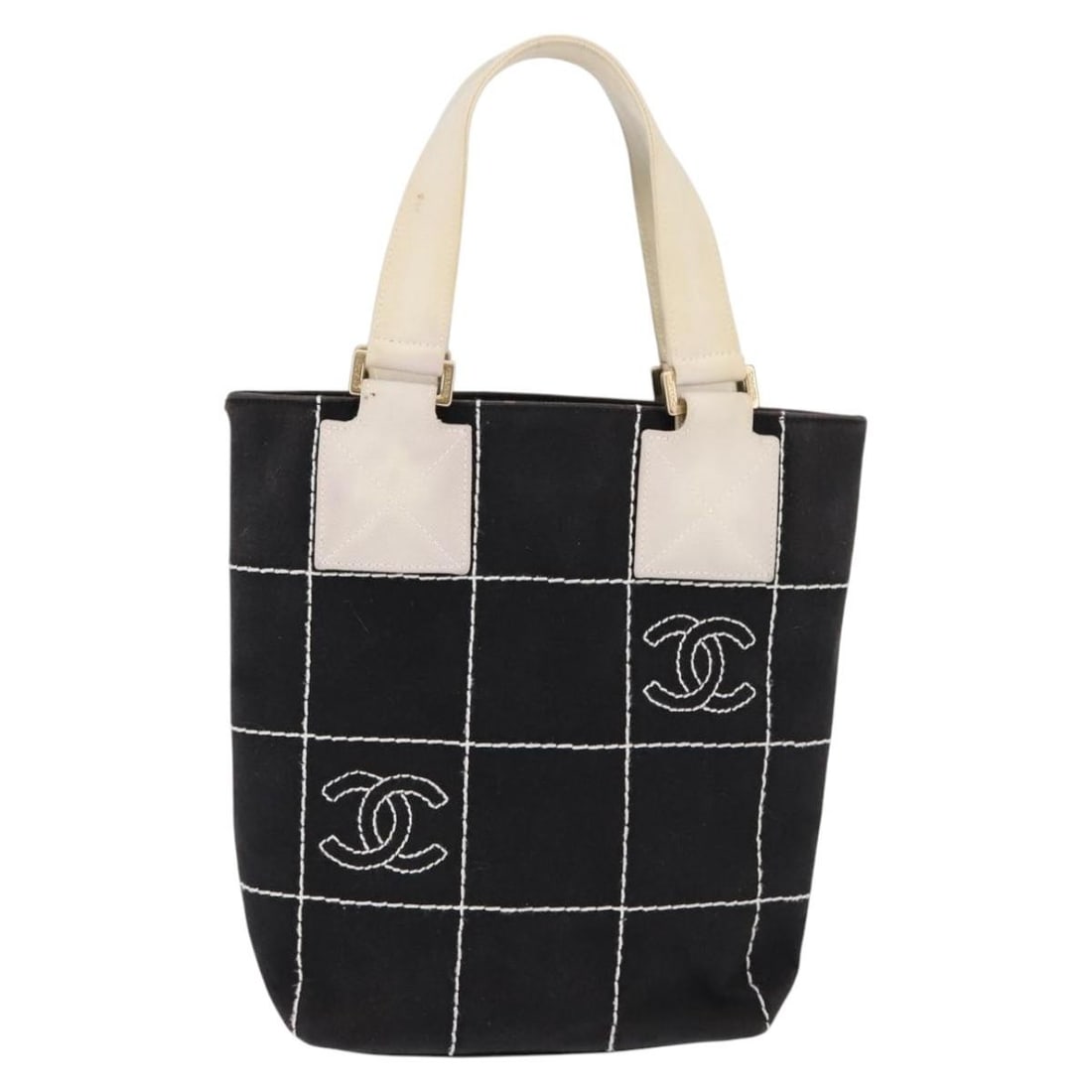 Choco Bar Tote Bag with CC Logo by Chanel in Black: Choco Bar Tote Bag with CC Logo by Chanel in Black This pre-owned Chanel Chocolate Bar CC Logo tote is crafted in black and designed for female use. The bag is in good condition, showing signs of use