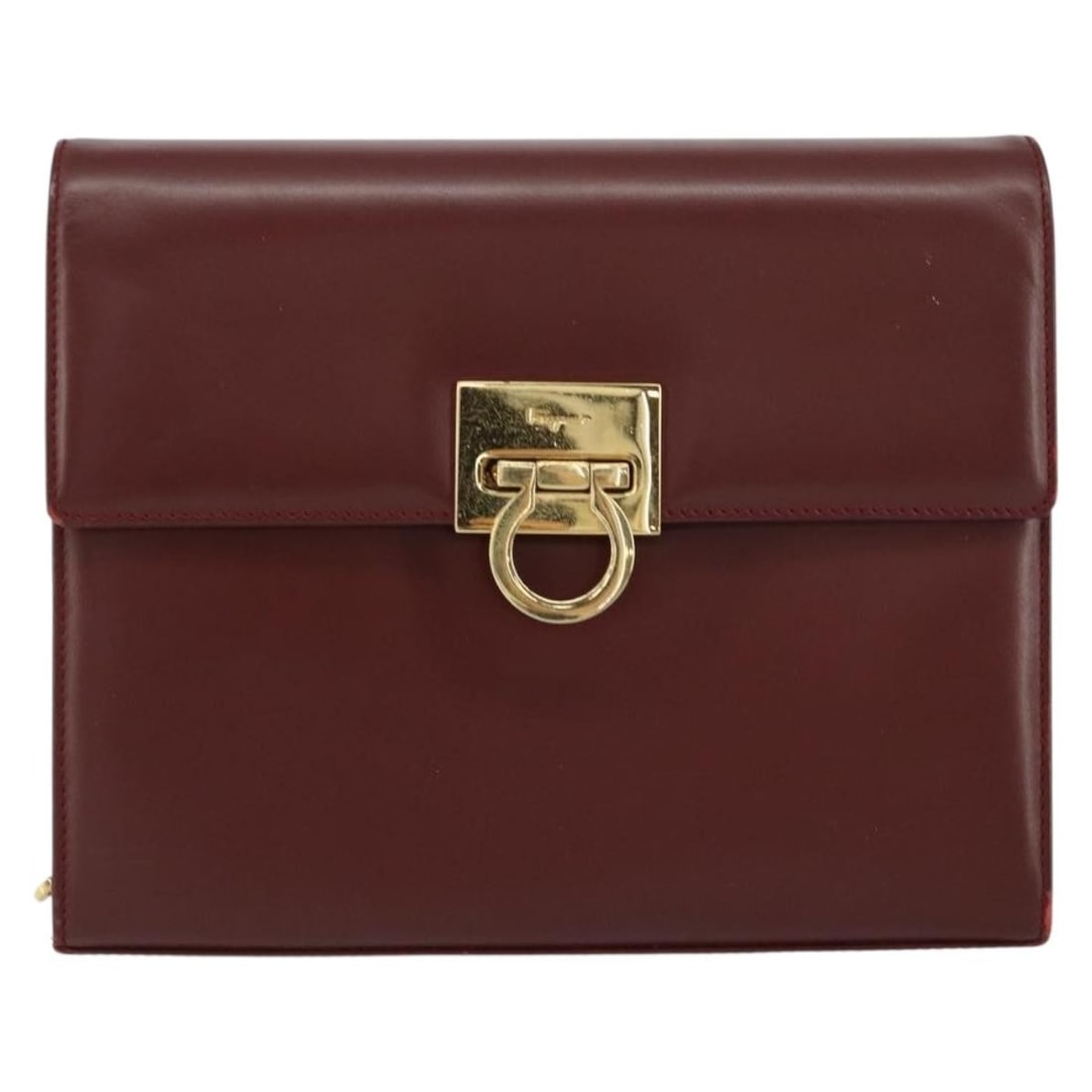Vintage Gancini Chain Shoulder Bag in Burgundy by Salvatore Ferragamo: Vintage Gancini Chain Shoulder Bag in Burgundy by Salvatore Ferragamo This vintage Salvatore Ferragamo Gancini chain shoulder bag in burgundy features a classic design with chain shoulder straps. The