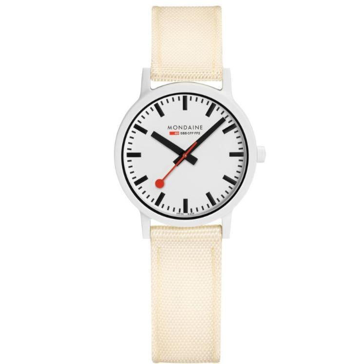 Mondaine Essence 32mm White Dial Ladies Watch Quartz Ivory Leather Strap: Mondaine Essence 32mm White Dial Ladies Watch Quartz Ivory Leather Strap Discover the elegance of the Mondaine Essence Ladies Watch, featuring a sophisticated 32mm round plastic case in a pristine whi