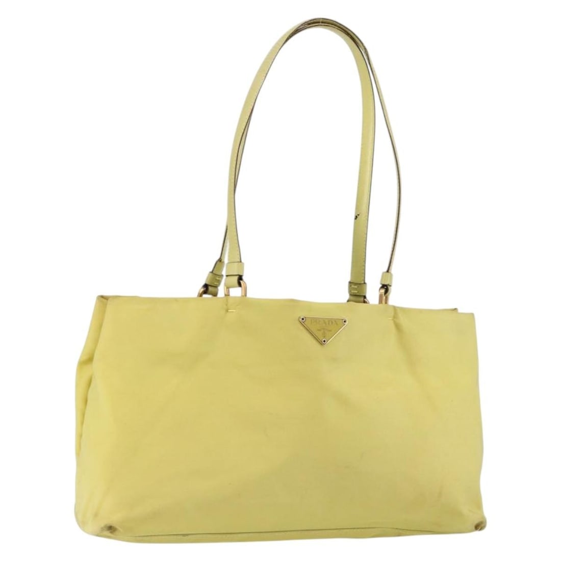Prada Gold Vintage Tote Bag with Signs of Wear: Prada Gold Vintage Tote Bag with Signs of Wear This pre-owned Prada vintage tote bag features a gold tone exterior and is designed for female use. The bag shows signs of use, including surface rubbing