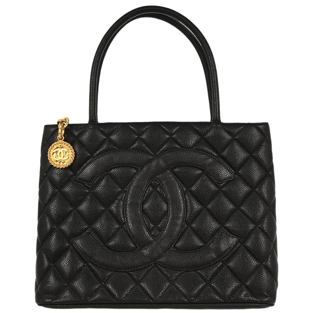 Chanel Black Caviar Leather Medallion Tote Handbag: Chanel Black Caviar Leather Medallion Tote Handbag Introducing the Chanel Black Calfskin Medallion Tote Handbag, a chic accessory perfect for casual occasions. This medium-sized tote features a beauti