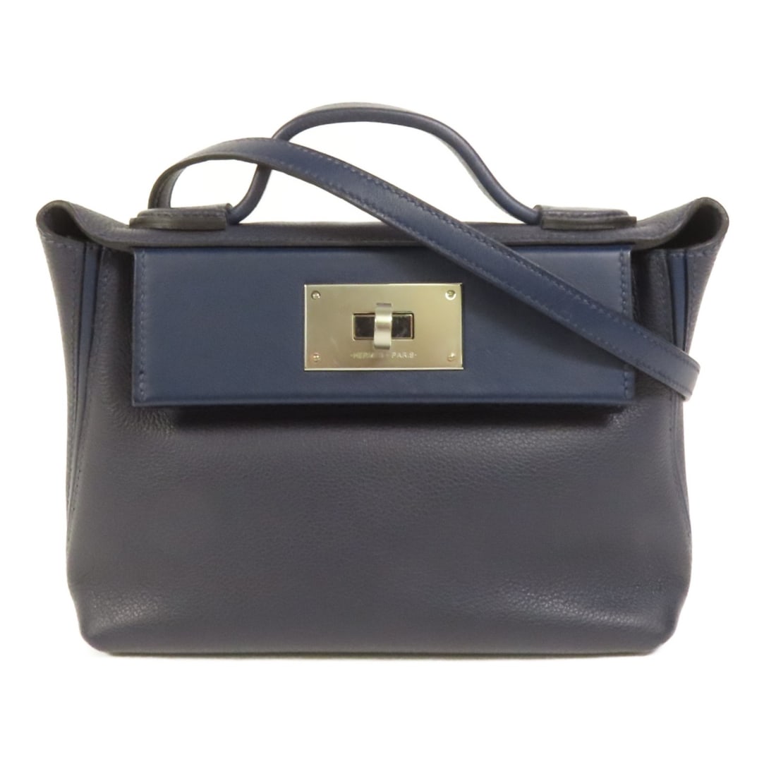 Hermes Bleu Nuit Clemence Leather Mini 24 24 Shoulder and Handbag with PHW: Hermes Bleu Nuit Clemence Leather Mini 24 24 Shoulder and Handbag with PHW This Hermes 24/24 Mini 2-way shoulder bag is crafted from Clemence leather in a deep Bleu Nuit color. Featuring a versatile d