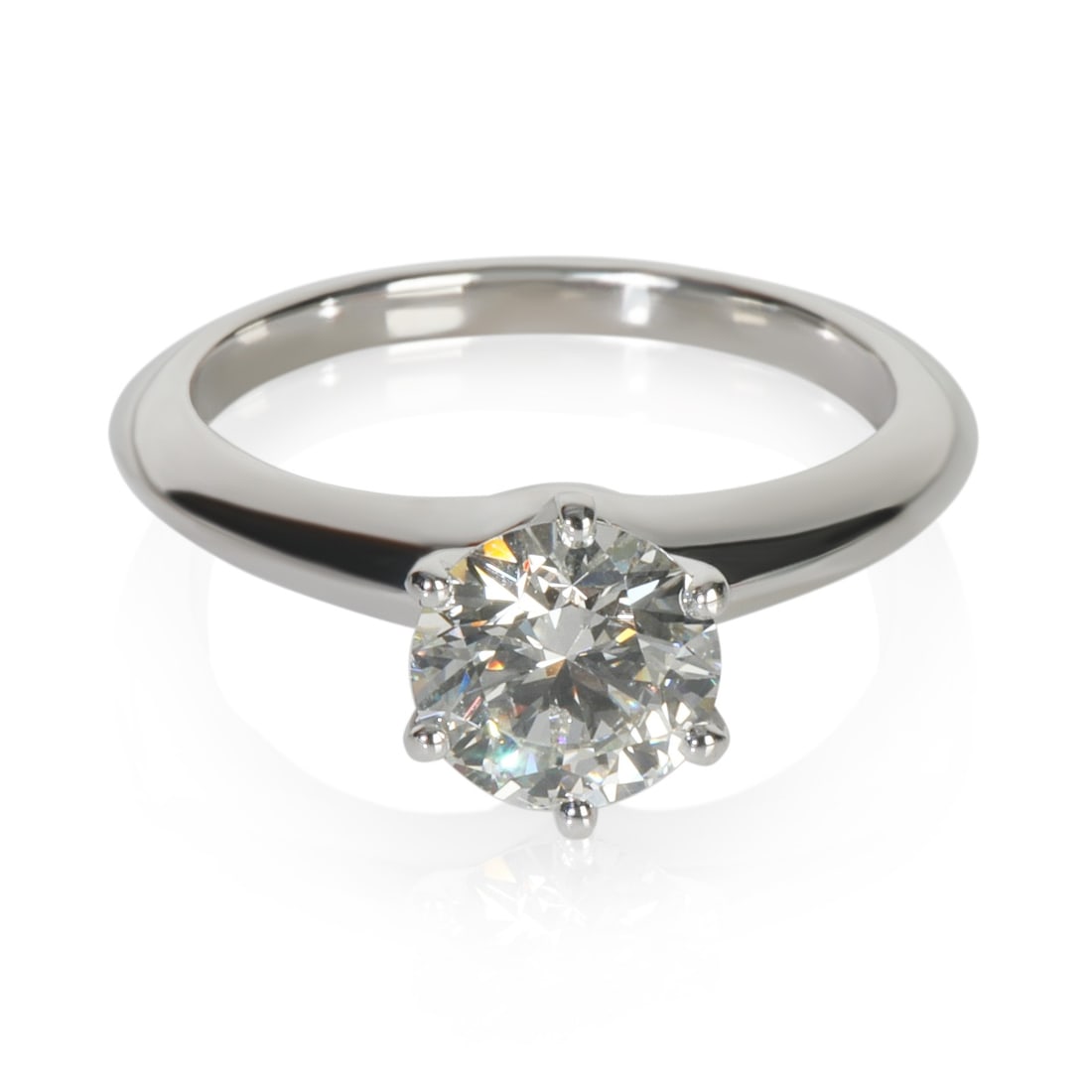 Tiffany & Co. 1.2 ct Round Diamond Platinum Engagement Ring: Tiffany & Co. 1.2 ct Round Diamond Platinum Engagement Ring This exquisite Tiffany & Co. engagement ring features a stunning 1.20 ct round brilliant diamond, renowned for its excellent cut and VVS2 cl
