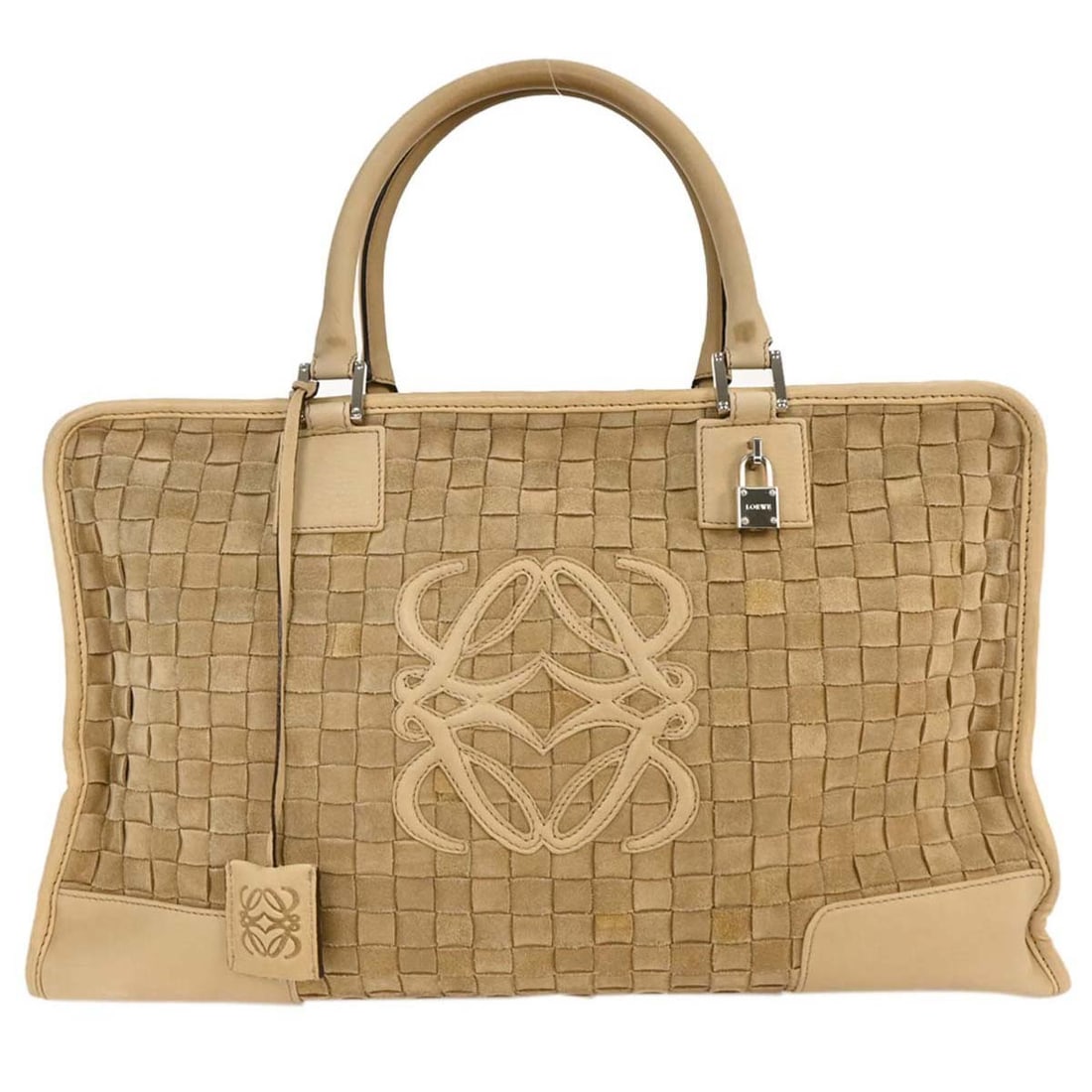 Amazona 44 Beige Travel Handbag by Loewe: Amazona 44 Beige Travel Handbag by Loewe This pre-owned Loewe Amazona 44 travel bag is crafted in beige and designed for women. The bag shows some scuffs and stains on the exterior, while the interior