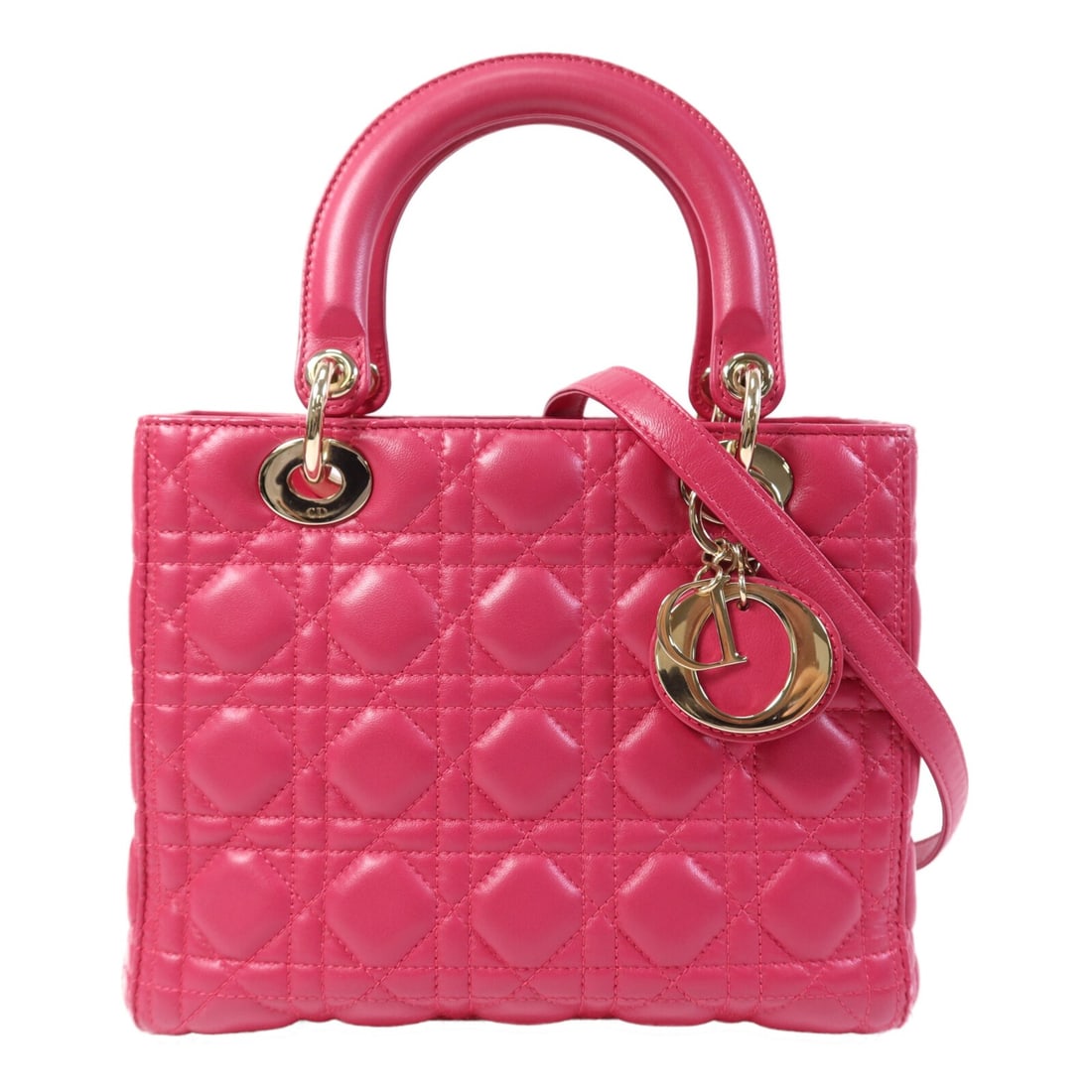 Dior Lady Dior Medium Pink Lambskin Two Way Shoulder Bag with Gold Hardware: Dior Lady Dior Medium Pink Lambskin Two Way Shoulder Bag with Gold Hardware This is a Christian Dior Lady Dior medium-sized two-way shoulder bag crafted from pink lambskin leather. It features a regul