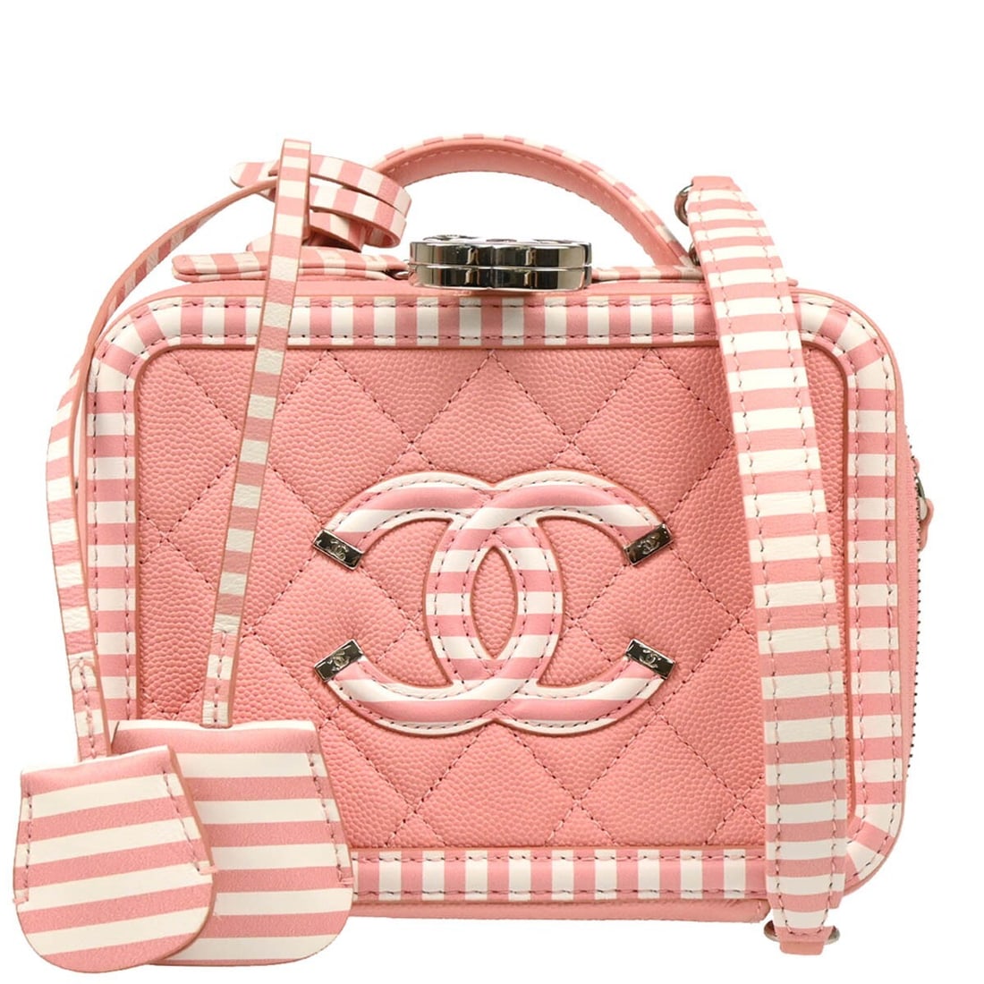 Pink Filigree Vanity Case by Chanel Clutch Style: Pink Filigree Vanity Case by Chanel Clutch Style This Chanel Filigree Vanity Case in pink features a classic clutch and pouch style, designed for female use. The exterior is in good condition with vis