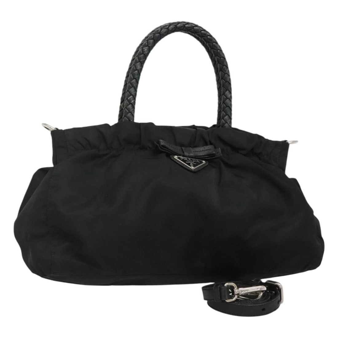 Convertible Bow Tote Handbag in Black by Prada: Convertible Bow Tote Handbag in Black by Prada This Prada Convertible Bow Tote in black is a versatile handbag designed for women. It features a spacious interior and multiple carrying options. The ba