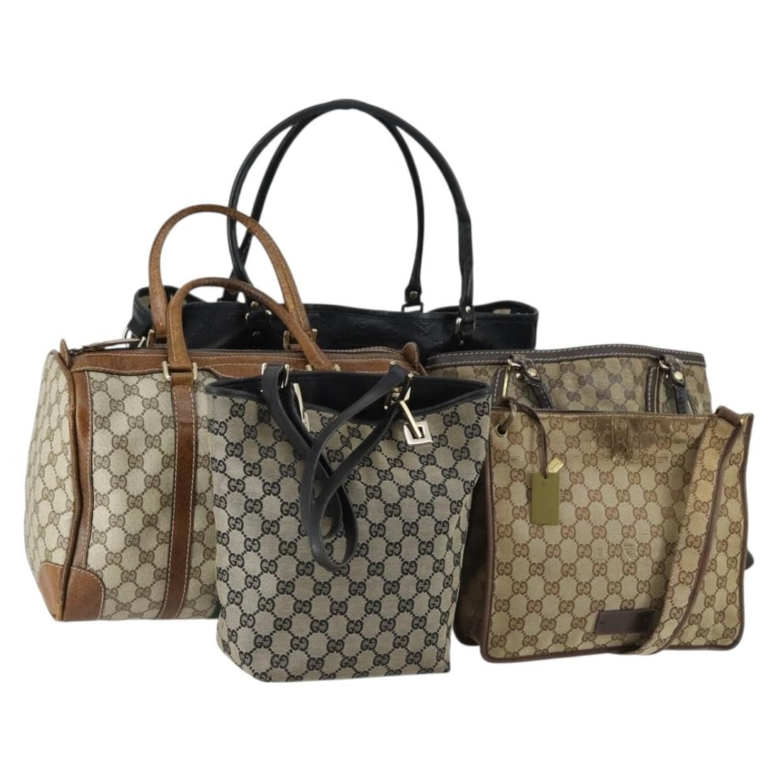 Set of 5 Gucci GG Canvas Tote Bags in Beige and Black: Set of 5 Gucci GG Canvas Tote Bags in Beige and Black This is a set of five authentic GUCCI GG Supreme Canvas tote bags in beige and black. Each bag features the signature GG canvas exterior. The set