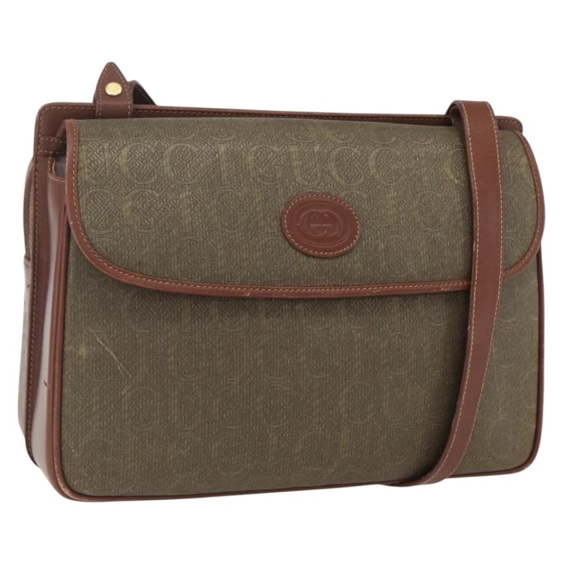 Brown and Gold Canvas GUCCI Shoulder Bag with Leather Trim: Brown and Gold Canvas GUCCI Shoulder Bag with Leather Trim This GUCCI shoulder bag features a brown and gold canvas exterior, offering a stylish and versatile accessory. The bag is made in Italy and i