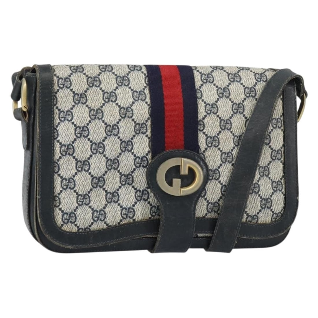 Navy GG Supreme Sherry Line PVC Shoulder Bag by Gucci: Navy GG Supreme Sherry Line PVC Shoulder Bag by Gucci This Gucci GG Supreme Sherry Line shoulder bag features a navy and gold color scheme with a PVC leather and GG canvas exterior. The bag is made in