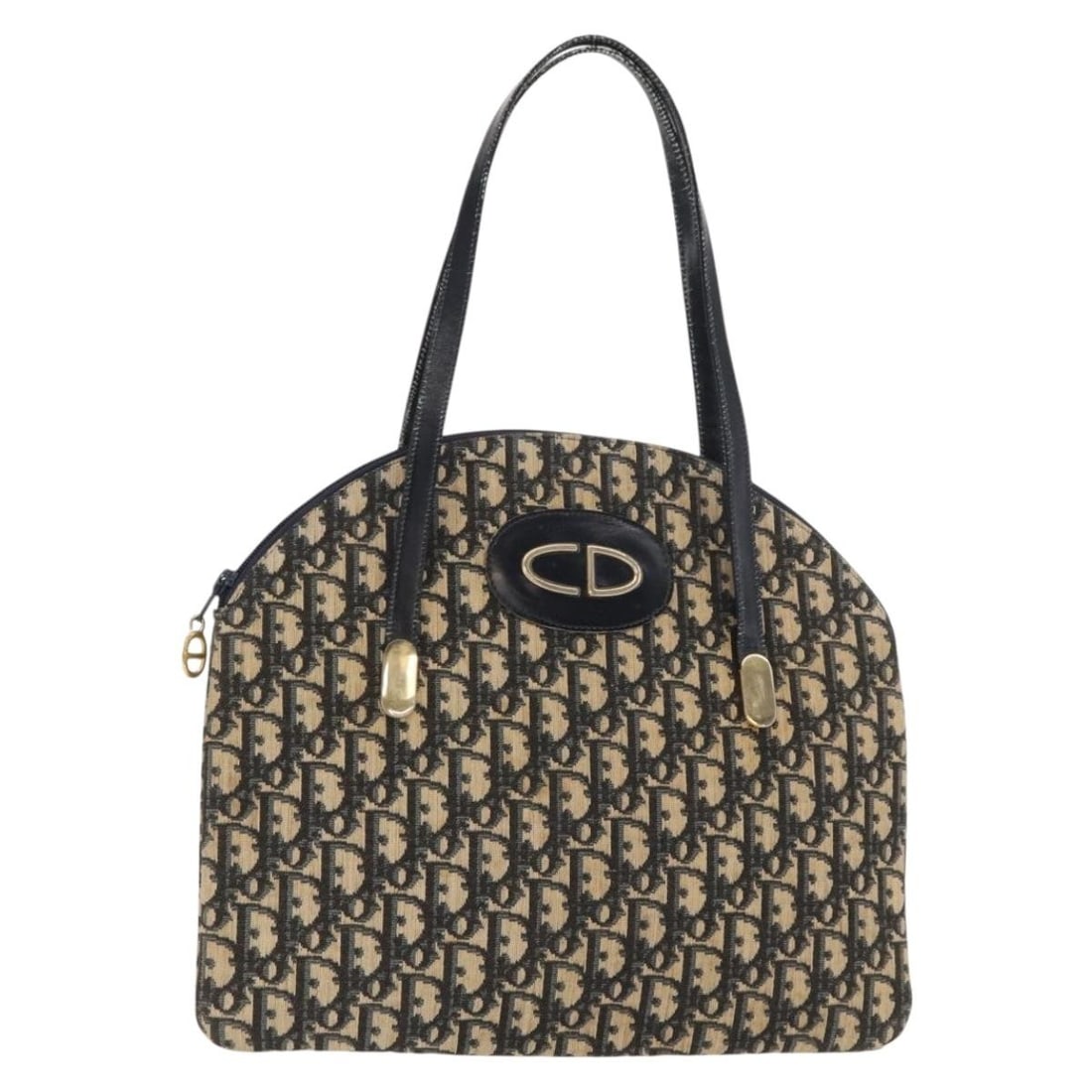 Navy and Gold Trotter Canvas Handbag by Christian Dior France: Navy and Gold Trotter Canvas Handbag by Christian Dior France This Christian Dior Trotter Canvas Hand Bag features a navy and gold color scheme with the iconic Trotter canvas exterior. Crafted in Fran