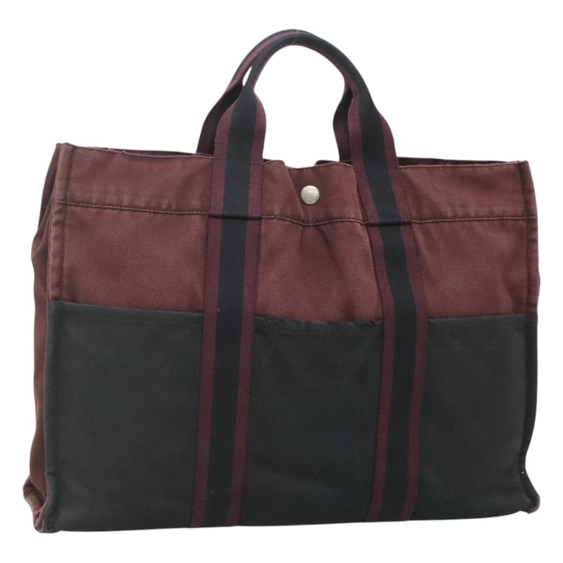 HERMES Fourre Tout MM Hand Bag Canvas Wine Red Made in France: HERMES Fourre Tout MM Hand Bag Canvas Wine Red Made in France This authentic HERMES Fourre Tout MM Hand Bag is a stylish accessory crafted from durable canvas in a sophisticated wine red color. With a