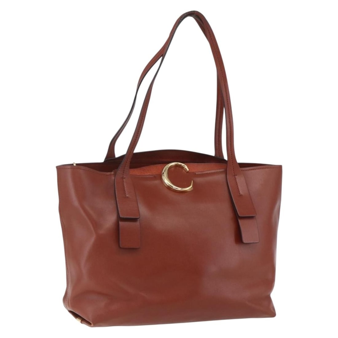 Chloe Brown Gold Leather Tote Bag Italy AM10080: Chloe Brown Gold Leather Tote Bag Italy AM10080 This Chloe Tote Bag is a sophisticated accessory crafted in Italy from premium leather. The bag features a stylish combination of brown and gold, making