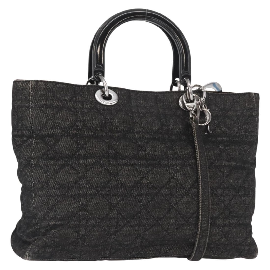 Lady Dior Black Canvas Handbag with Shoulder Strap and Charm by Christian Dior: Lady Dior Black Canvas Handbag with Shoulder Strap and Charm by Christian Dior This Christian Dior Lady Dior Canage hand bag features a black and silver canvas exterior with silver-tone hardware. It o