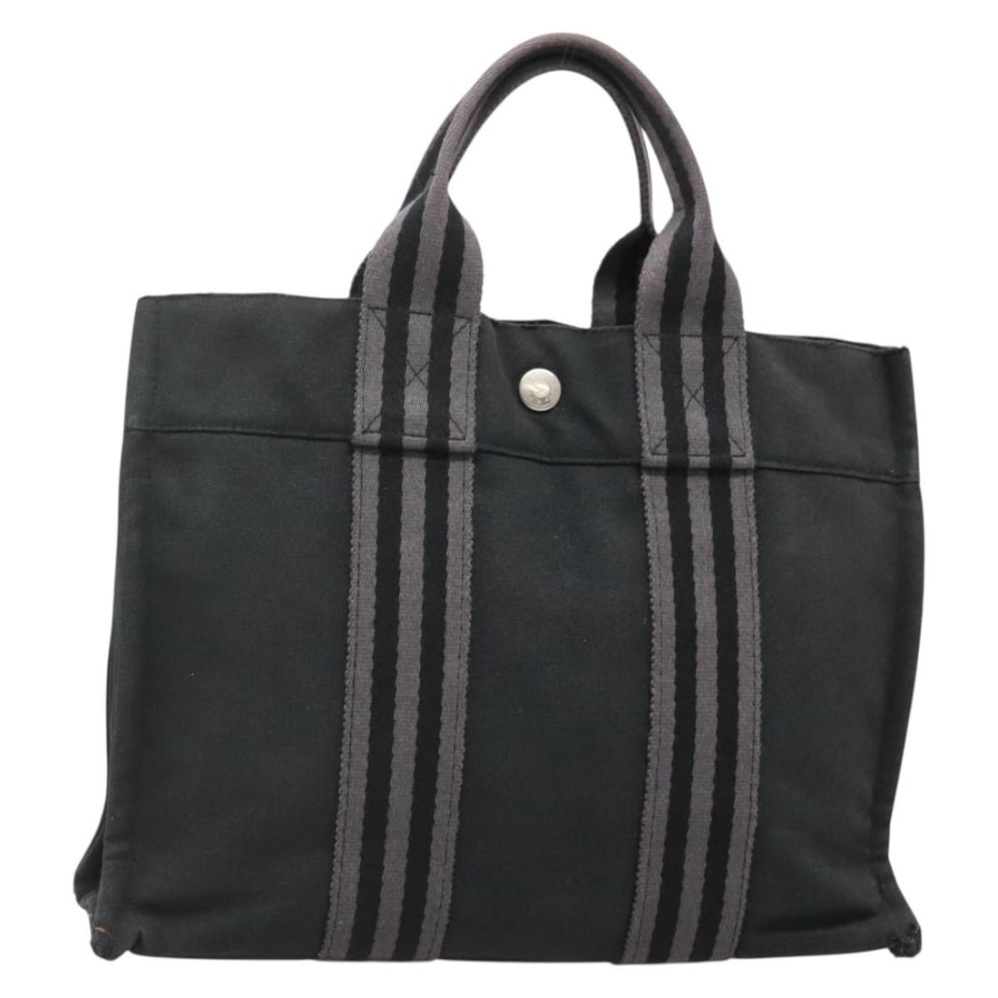 HERMES Fourre Tout PM Canvas Hand Bag Black Gray Made in France: HERMES Fourre Tout PM Canvas Hand Bag Black Gray Made in France This HERMES Fourre Tout PM Hand Bag is a stylish and versatile accessory, crafted from durable canvas in a sleek black and gray color co