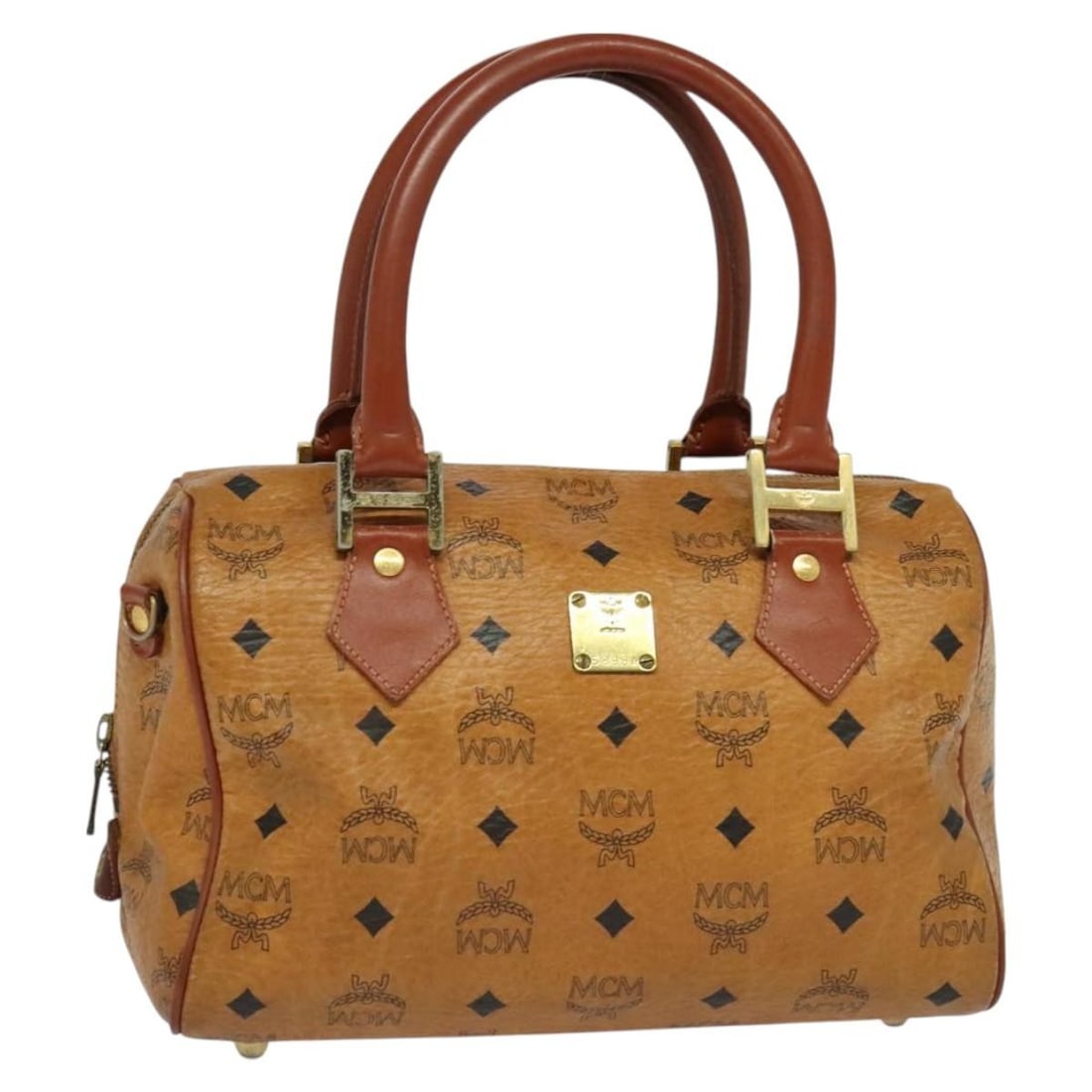 MCM Brown Gold PVC Leather Hand Bag Made in Italy: MCM Brown Gold PVC Leather Hand Bag Made in Italy Introducing the MCM Hand Bag, a luxurious accessory crafted from durable PVC leather in a striking brown and gold color combination. This stylish hand