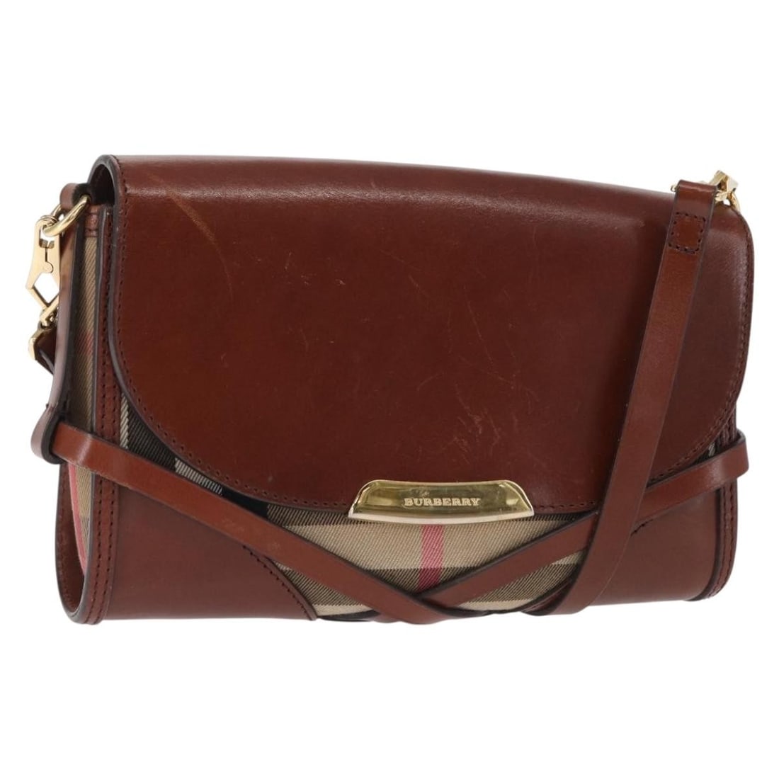Burberry Brown Leather Shoulder Bag Gold Accents Made in Italy: Burberry Brown Leather Shoulder Bag Gold Accents Made in Italy This BURBERRY shoulder bag features a brown and gold leather exterior and is crafted in Italy. The bag has a compact design with an adjus