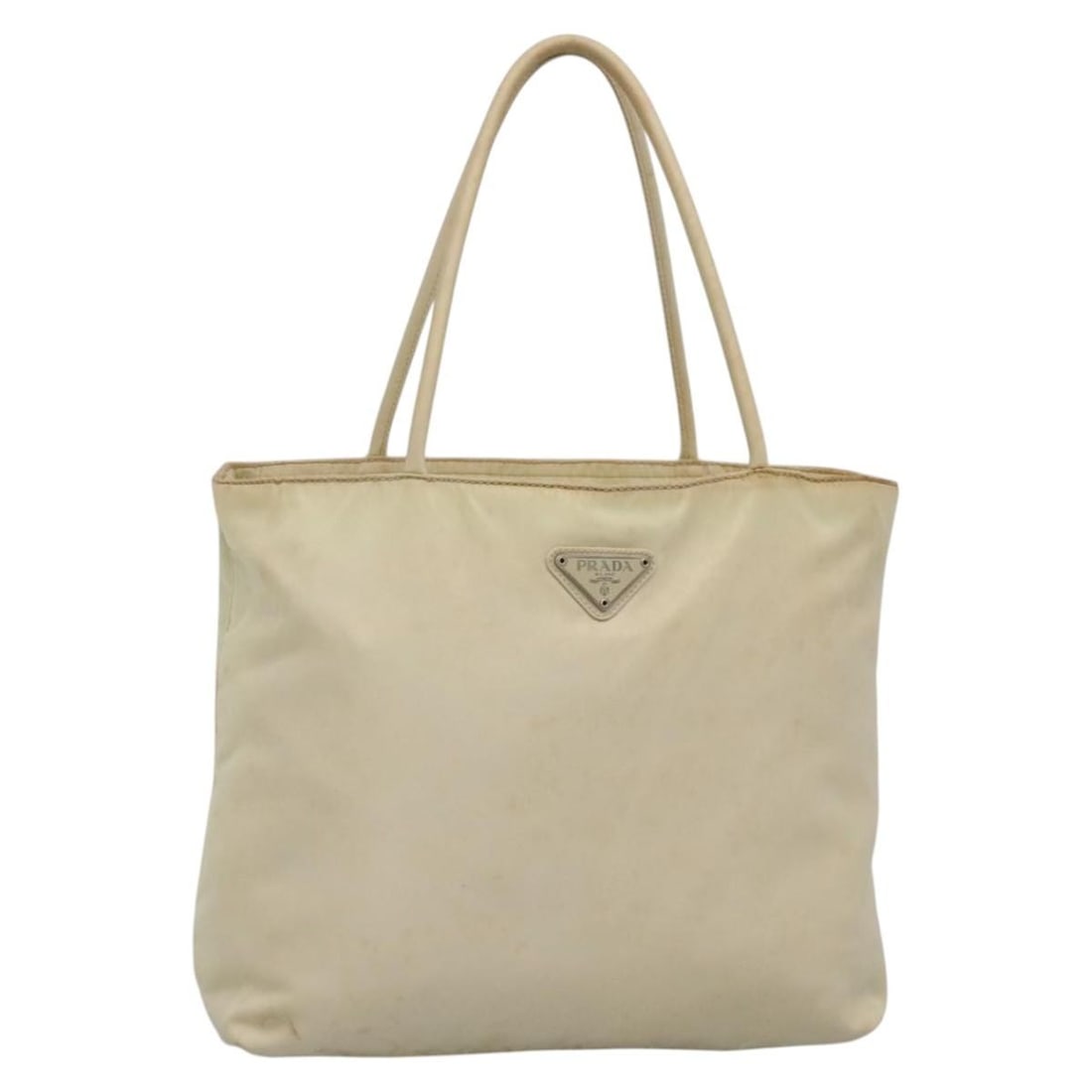 PRADA Beige Nylon Hand Bag Made in Italy Auth 48236: PRADA Beige Nylon Hand Bag Made in Italy Auth 48236 This authentic PRADA hand bag is crafted from durable nylon in a sophisticated beige hue. It's designed for both style and practicality, featuring a