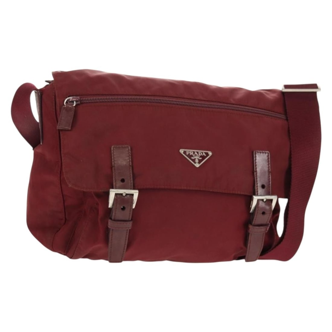 Prada Bordeaux Nylon Shoulder Bag with Silver Tone Hardware: Prada Bordeaux Nylon Shoulder Bag with Silver Tone Hardware This PRADA shoulder bag is crafted from bordeaux nylon with silver-tone accents. Made in Italy, it features an adjustable shoulder strap and