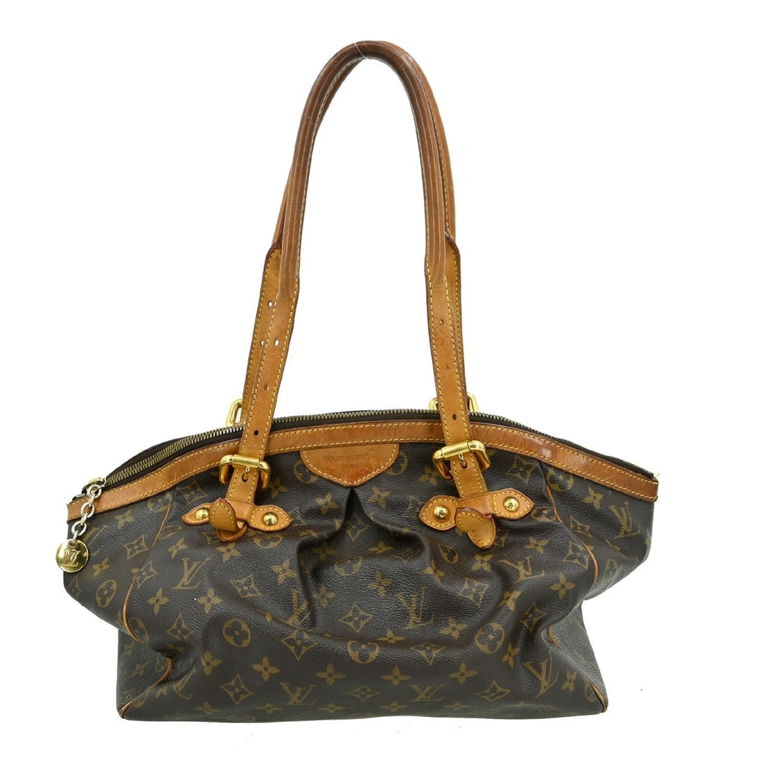 Louis Vuitton Tivoli GM Handbag Monogram Canvas Vintage Brown: Louis Vuitton Tivoli GM Handbag Monogram Canvas Vintage Brown This elegant Louis Vuitton Tivoli GM handbag is crafted from durable Monogram canvas with leather accents. Featuring a stylish brown exter