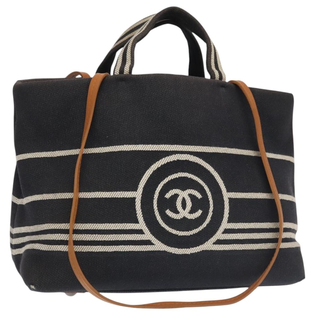 CHANEL Navy Canvas Tote Bag Made in Italy Authenticated: CHANEL Navy Canvas Tote Bag Made in Italy Authenticated This authentic CHANEL Tote Bag showcases a stylish navy denim exterior crafted from durable canvas. The bag features a spacious interior, making