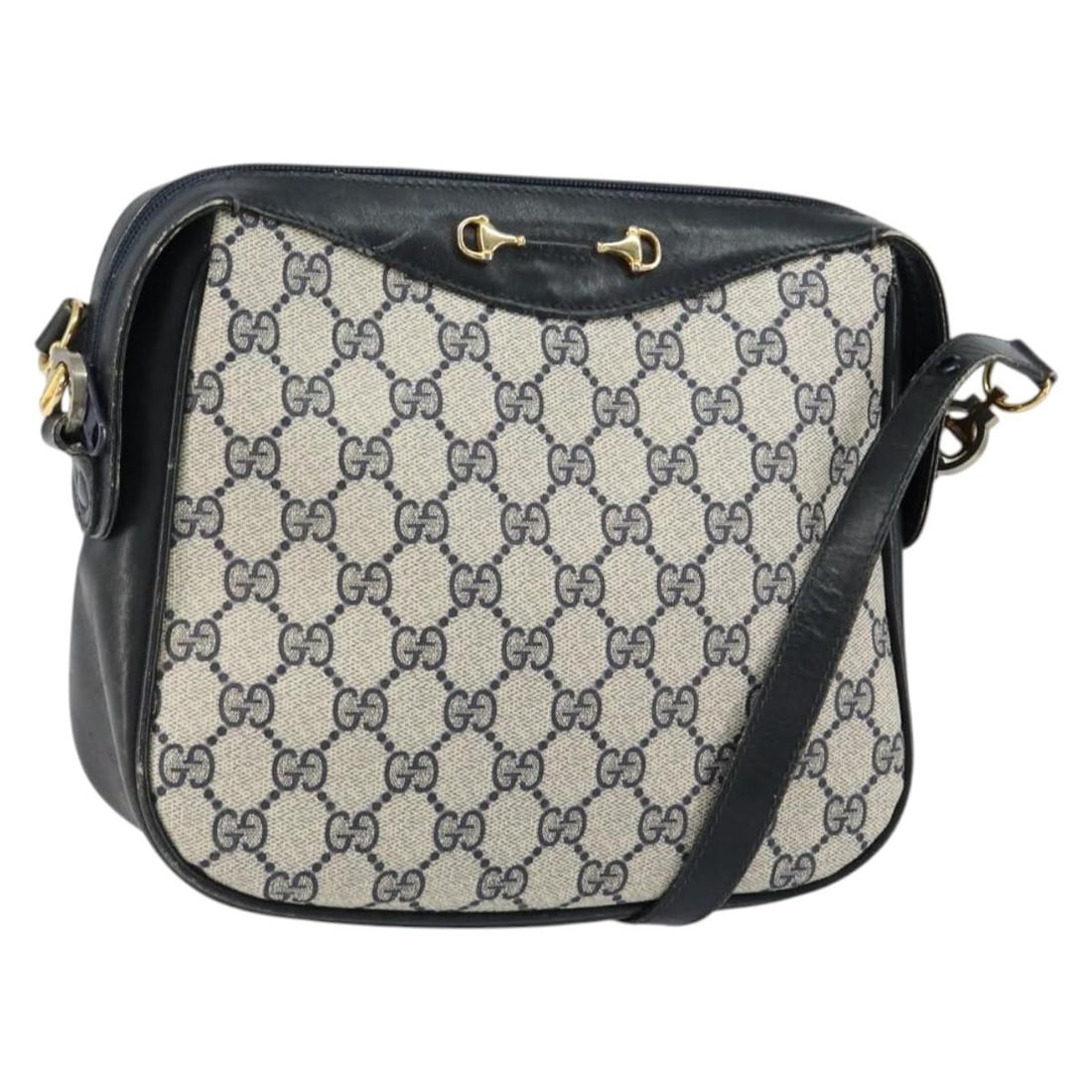 GUCCI GG Supreme Horsebit PVC Shoulder Bag Navy Gold Silver: GUCCI GG Supreme Horsebit PVC Shoulder Bag Navy Gold Silver This GUCCI GG Supreme Horsebit Shoulder Bag is a stylish accessory crafted in Italy from durable PVC leather and GG canvas. The exterior fea