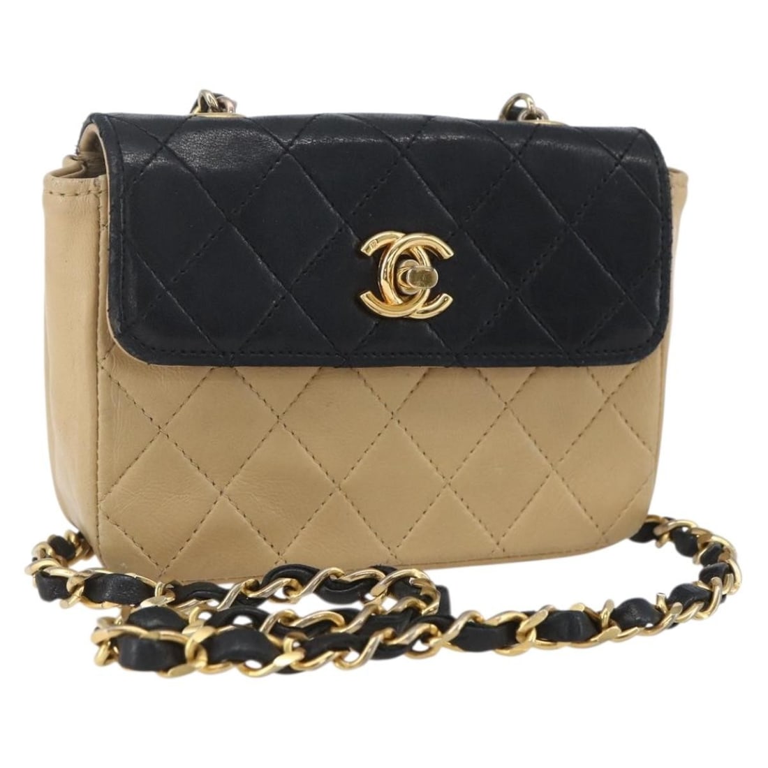 Chanel Beige Black Lambskin Matelasse Chain Shoulder Bag CC Logo: Chanel Beige Black Lambskin Matelasse Chain Shoulder Bag CC Logo This CHANEL Matelasse chain shoulder bag features luxurious lambskin leather in a beige and black color combination. The bag has a comp