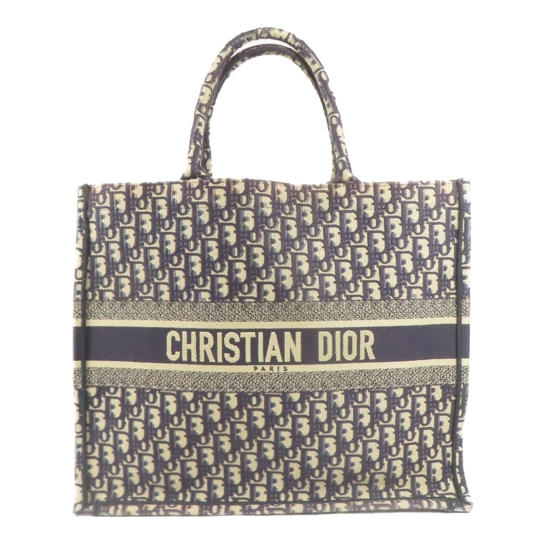 Christian Dior Blue Canvas CD Book Tote Handbag: Christian Dior Blue Canvas CD Book Tote Handbag This Christian Dior CD Book Tote Handbag showcases a stylish yet functional design, crafted from durable blue canvas. It features a spacious interior su