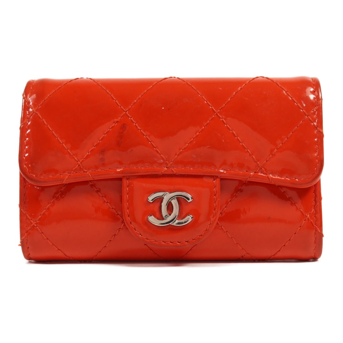 CHANEL Red Patent Leather Key Holder with SHW: CHANEL Red Patent Leather Key Holder with SHW This CHANEL key holder is a stylish accessory crafted from luxurious patent leather in a vibrant red hue. Designed for practicality, it features a sleek a