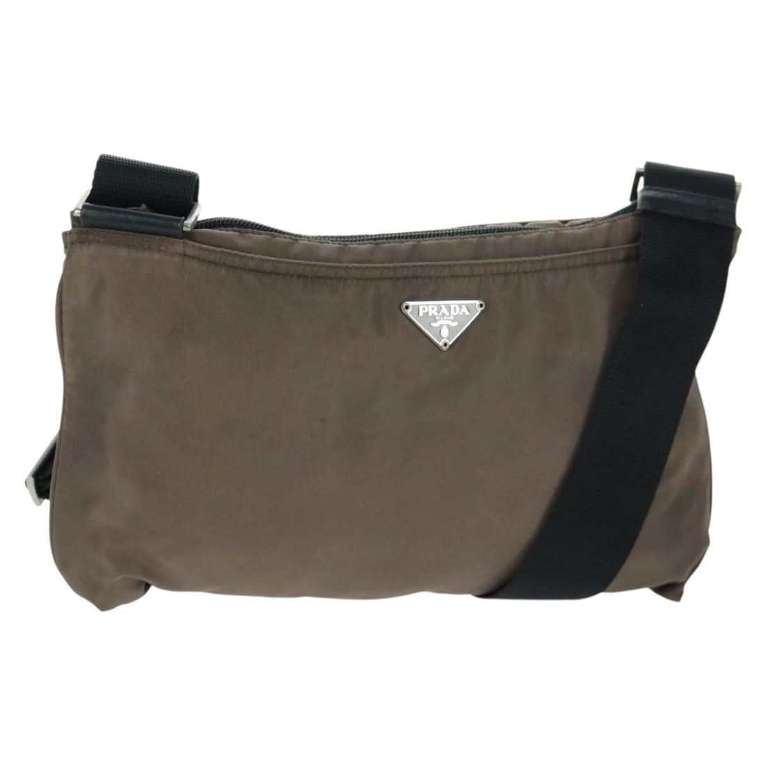 Beige Prada Nylon Shoulder Bag with Silver Accents Made in Italy: Beige Prada Nylon Shoulder Bag with Silver Accents Made in Italy This PRADA shoulder bag is crafted from beige nylon with silver-tone accents. Made in Italy, it features an adjustable shoulder strap a