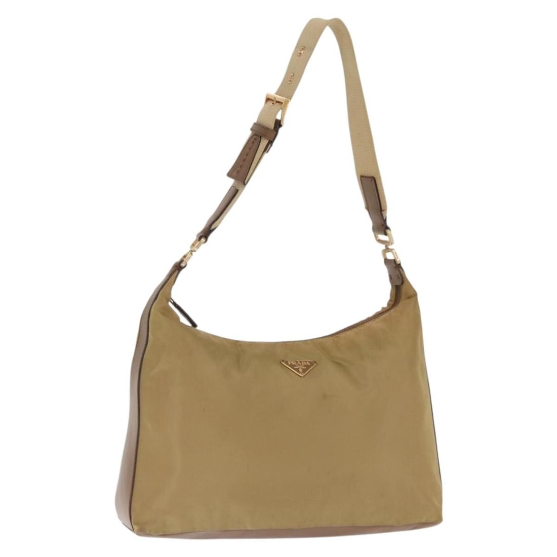 Beige and Gold Nylon Prada Shoulder Bag from Italy: Beige and Gold Nylon Prada Shoulder Bag from Italy This PRADA shoulder bag is crafted from beige and gold nylon and was made in Italy. The bag features a spacious interior and adjustable shoulder stra