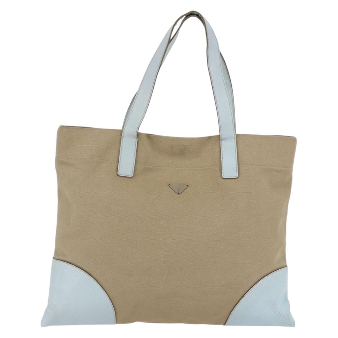 PRADA Beige Light Blue Canvas Tote Bag Italy Auth: PRADA Beige Light Blue Canvas Tote Bag Italy Auth This authentic PRADA tote bag is a stylish and functional accessory, crafted in Italy from durable canvas material. The exterior features a chic combi