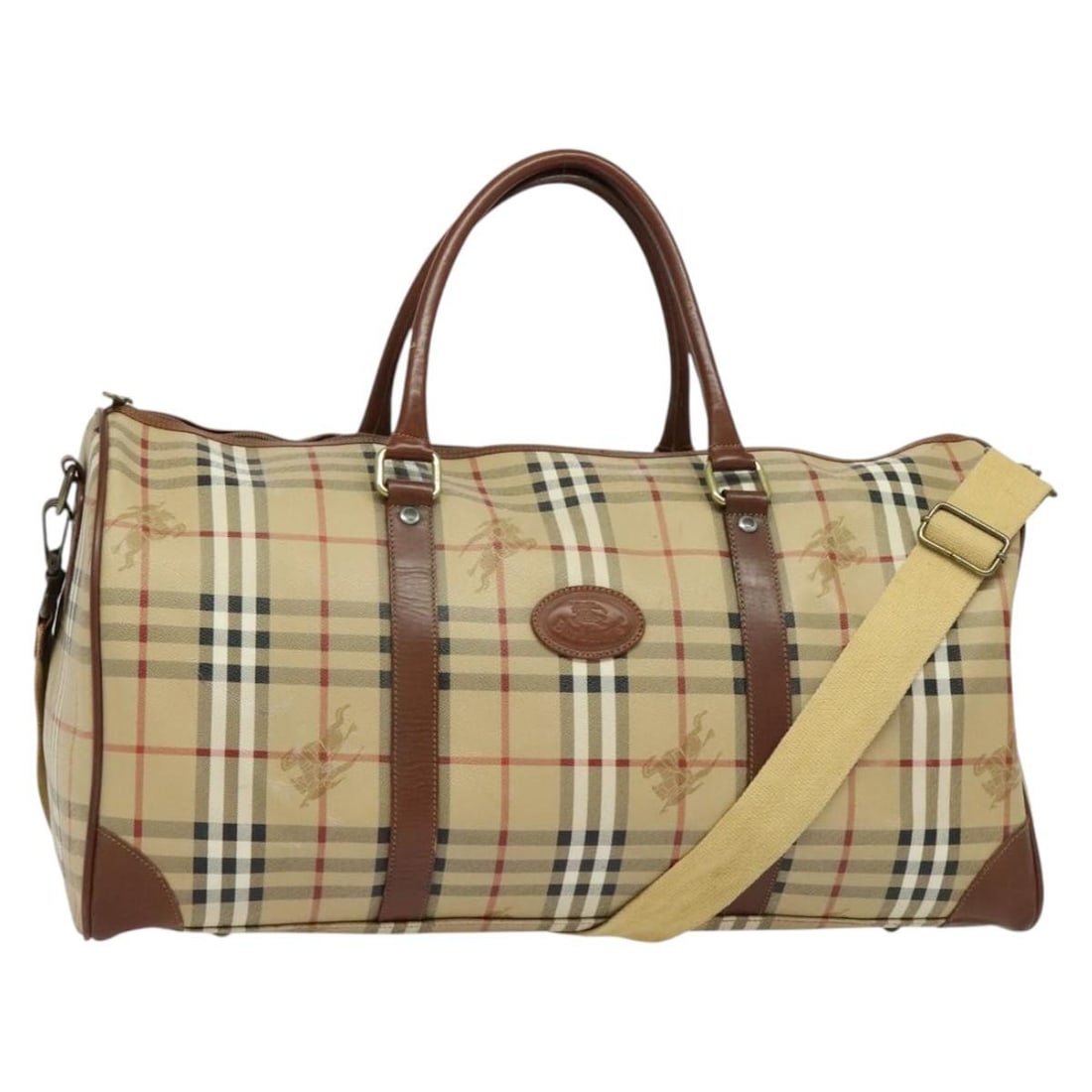 Burberrys Nova Check Beige PVC Leather Boston Bag with Strap: Burberrys Nova Check Beige PVC Leather Boston Bag with Strap This Burberrys Nova Check Boston Bag is a stylish accessory crafted from durable PVC leather in a classic beige hue. Designed for versatili