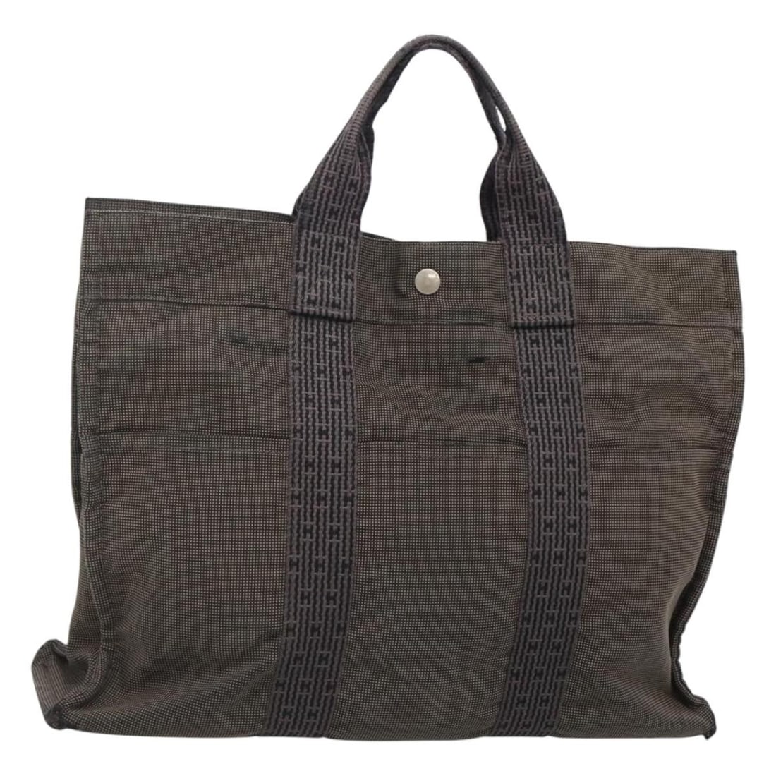 HERMES Her Line MM Hand Bag Canvas Gray Silver Made in France: HERMES Her Line MM Hand Bag Canvas Gray Silver Made in France This HERMES Her Line MM Hand Bag combines luxury with everyday practicality. Crafted from durable canvas in a sophisticated gray and silve