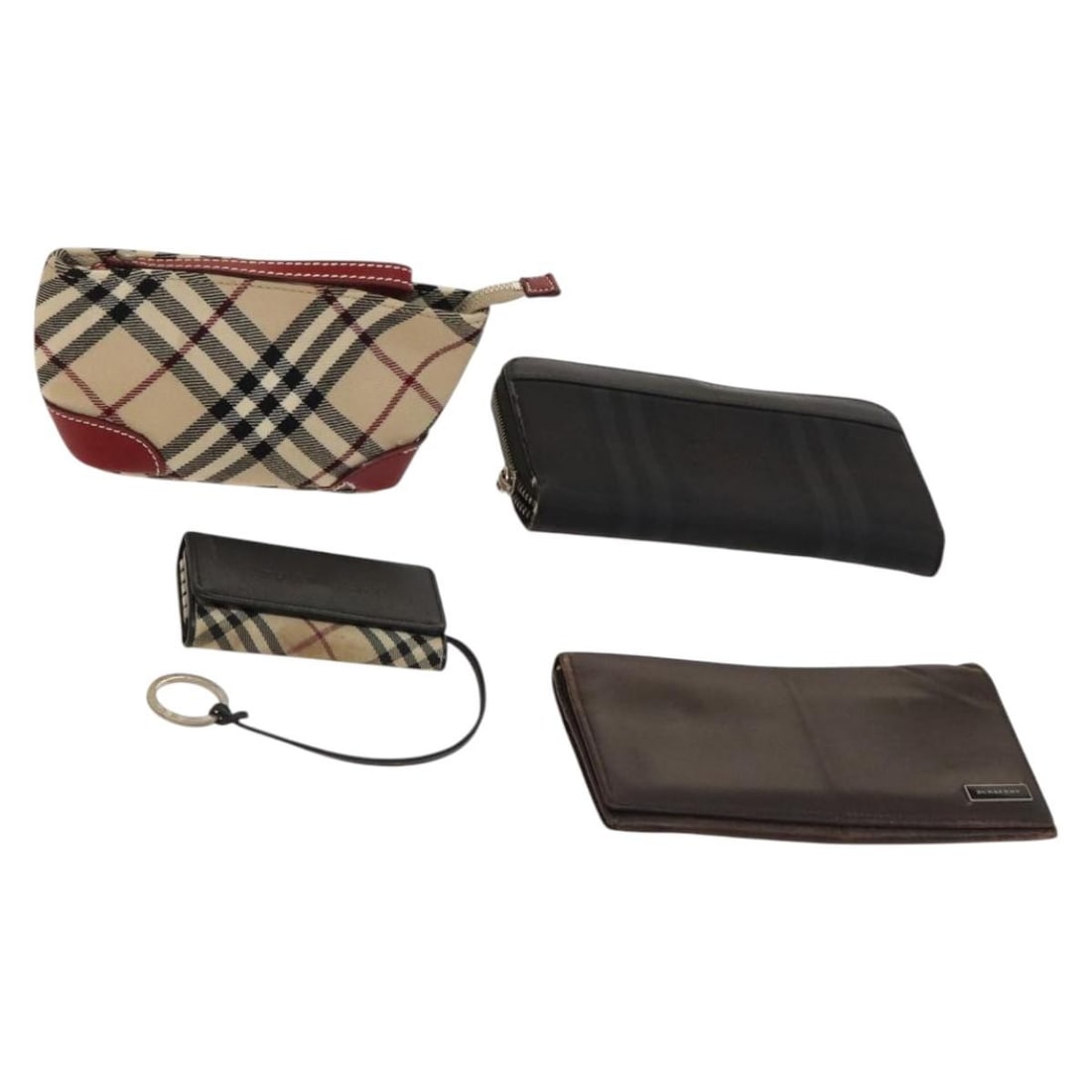 MCM Nova Check Blue Label Canvas Wallet Set 4 Pieces Auth: MCM Nova Check Blue Label Canvas Wallet Set 4 Pieces Auth This MCM Nova Check Blue Label Key Case Pouch Wallet set is crafted from durable canvas in a stylish beige, brown, and black color scheme. The