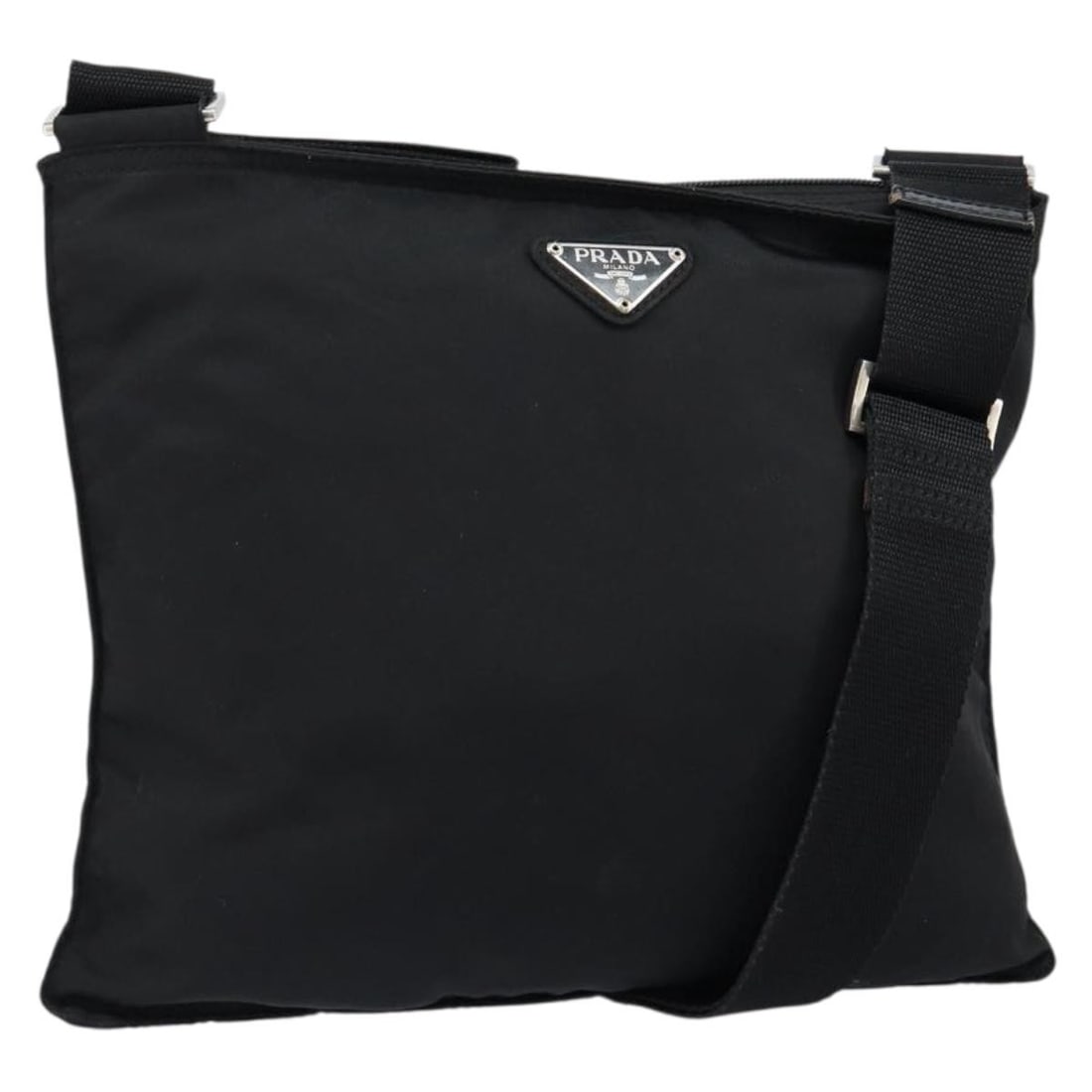Black Nylon Prada Shoulder Bag with Silver Accents: Black Nylon Prada Shoulder Bag with Silver Accents This PRADA shoulder bag is crafted from black nylon with silver-tone accents. Made in Italy, the bag features an adjustable shoulder strap for versat