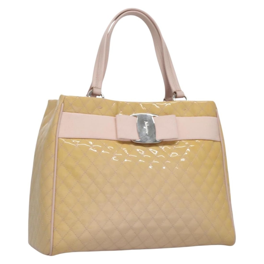 Salvatore Ferragamo Vala Hand Bag Beige Patent Leather Silver Accents: Salvatore Ferragamo Vala Hand Bag Beige Patent Leather Silver Accents This Salvatore Ferragamo Vala Hand Bag exudes elegance with its beige and silver patent leather exterior. Crafted in Italy, this s