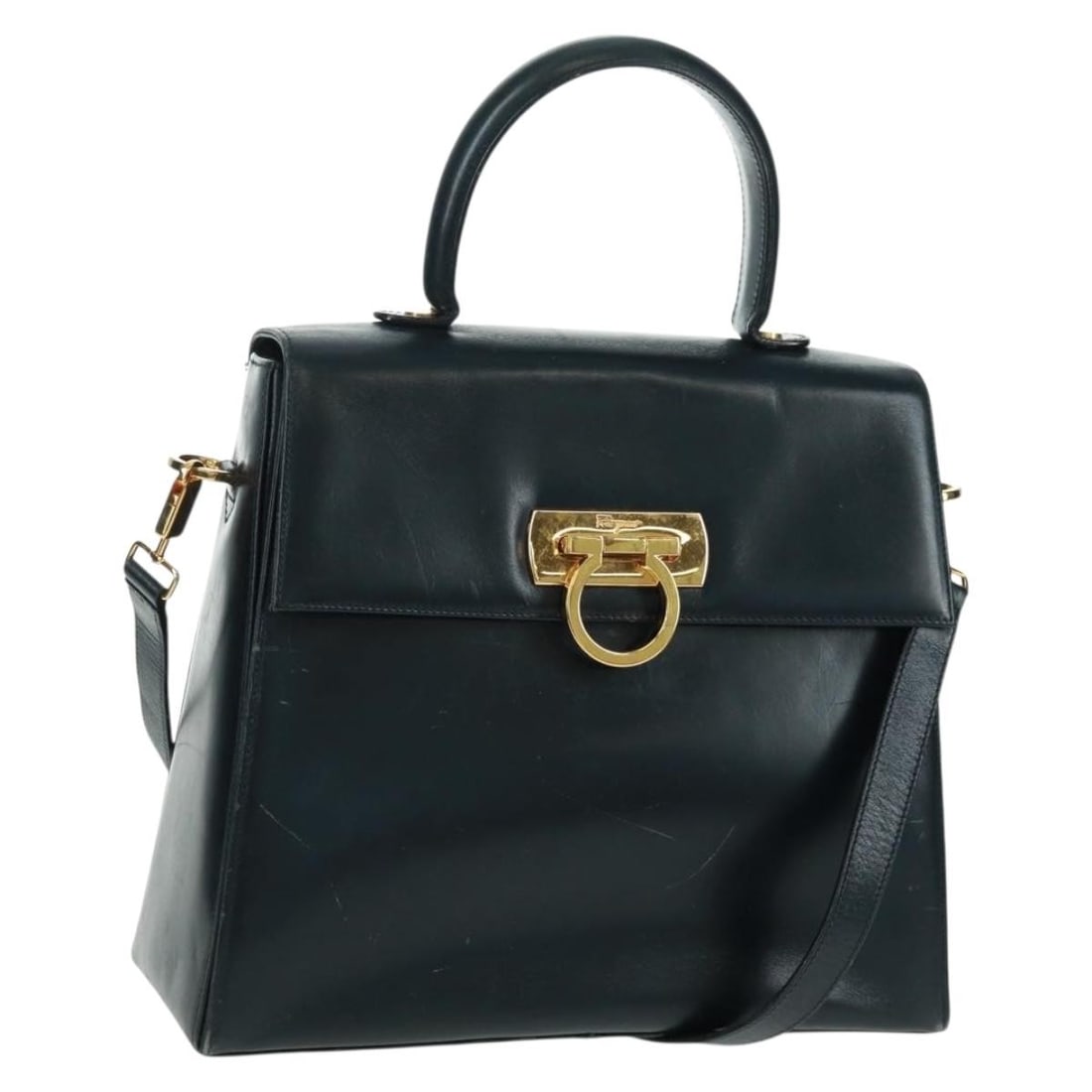 Salvatore Ferragamo Gancini Navy Leather Shoulder and Handbag with Gold Accents: Salvatore Ferragamo Gancini Navy Leather Shoulder and Handbag with Gold Accents This Salvatore Ferragamo Gancini handbag features a two-way design crafted from navy leather with gold-tone accents. It