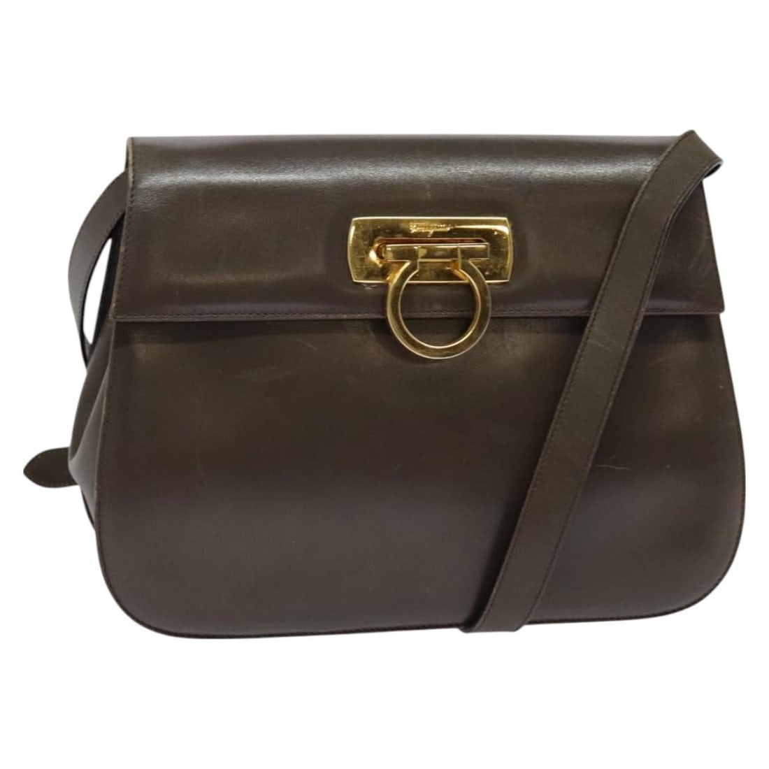 Salvatore Ferragamo Gancini Brown Gold Leather Shoulder Bag Auth Italy: Salvatore Ferragamo Gancini Brown Gold Leather Shoulder Bag Auth Italy This Salvatore Ferragamo Gancini Shoulder Bag is a luxurious accessory that embodies Italian craftsmanship. Made from supple brow