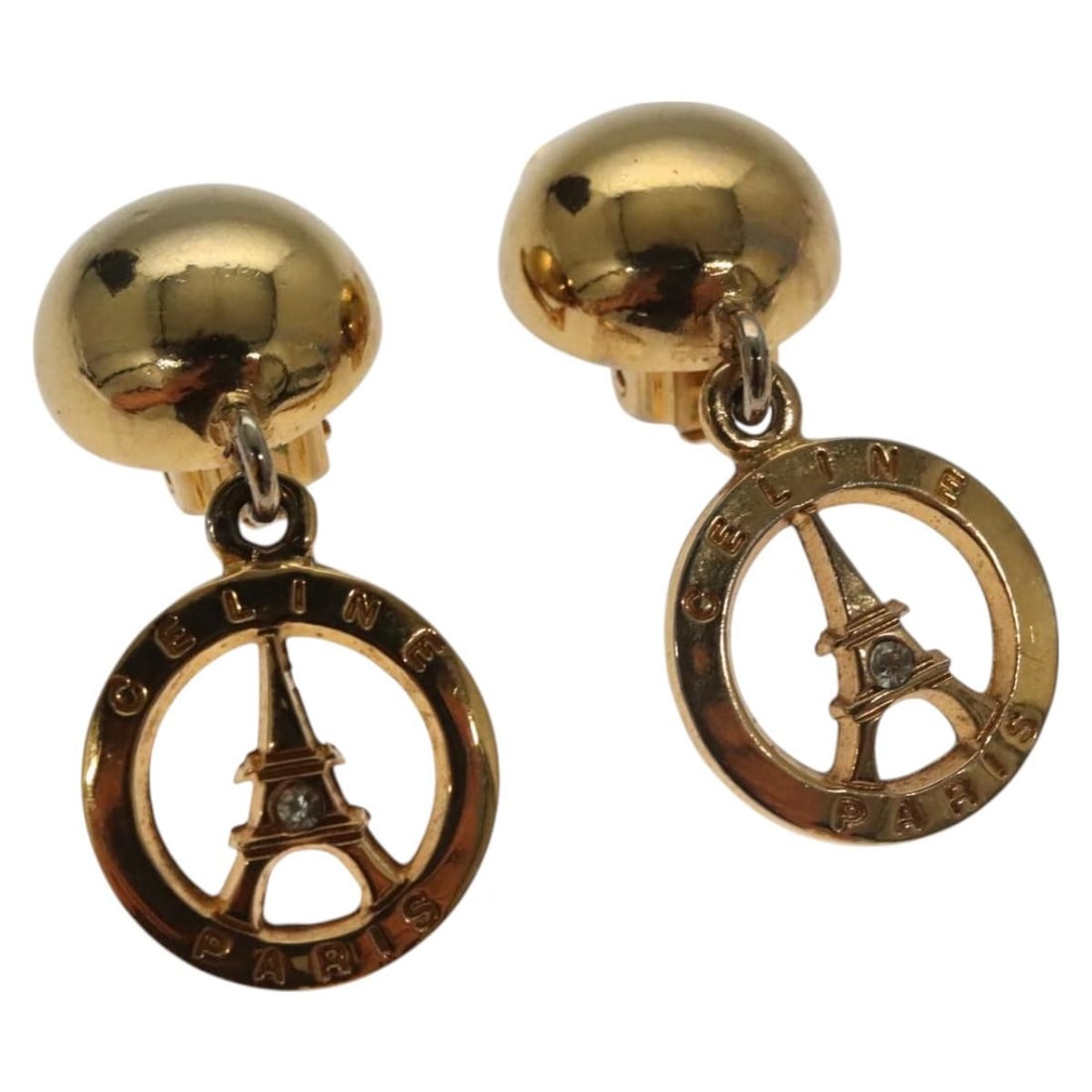 CELINE Gold Metal Earrings Authentic BS27019: CELINE Gold Metal Earrings Authentic BS27019 Elevate your accessory collection with these stunning CELINE earrings. Crafted from durable metal and finished in an elegant gold tone, these earrings are