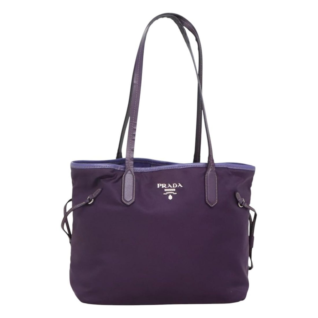 PRADA Purple Silver Nylon Tote Bag Authentic Made in Italy: PRADA Purple Silver Nylon Tote Bag Authentic Made in Italy This stylish PRADA tote bag is crafted from durable nylon in a striking purple and silver color combination. Designed for functionality, it f