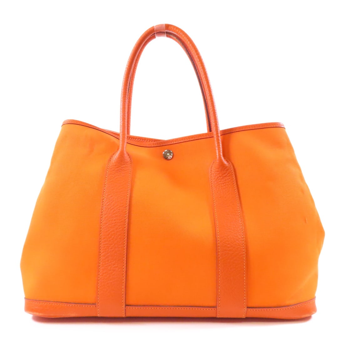HERMES Garden Party PM Tote Bag Orange Canvas Handbag: HERMES Garden Party PM Tote Bag Orange Canvas Handbag Elevate your accessory collection with this HERMES Garden Party PM Tote Bag. Crafted from durable canvas, this stylish tote features a vibrant ora