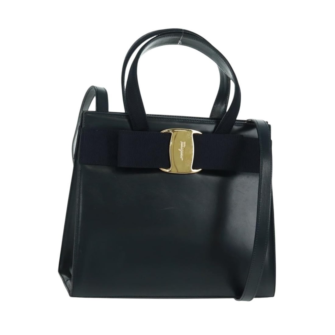 Salvatore Ferragamo Vala Navy Leather Convertible Handbag with Gold Accents: Salvatore Ferragamo Vala Navy Leather Convertible Handbag with Gold Accents This Salvatore Ferragamo Vala handbag is crafted from navy leather with gold-tone accents and offers both hand and shoulder