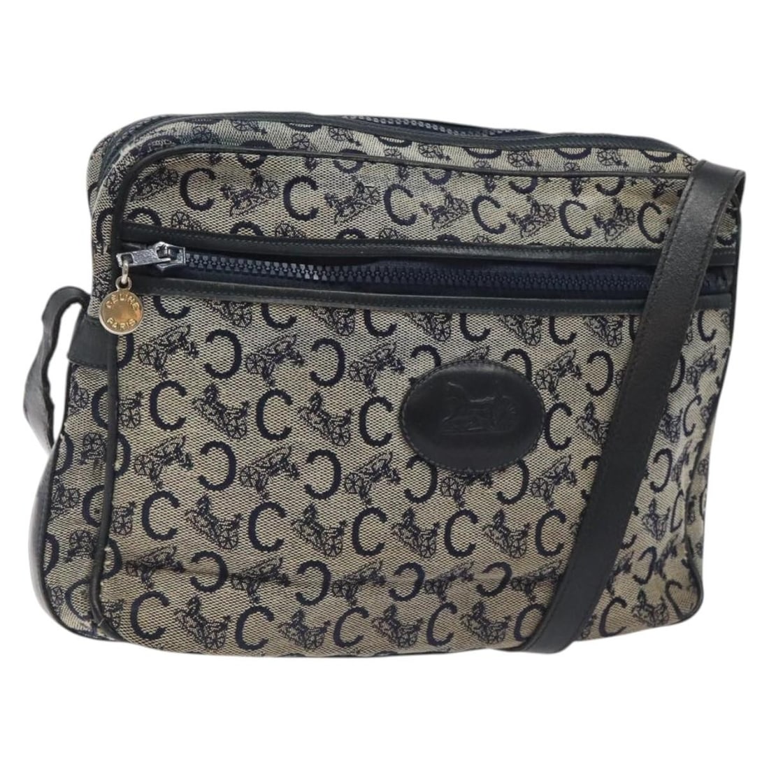 CELINE C Sulky Navy Gold Canvas Shoulder Bag Italy: CELINE C Sulky Navy Gold Canvas Shoulder Bag Italy Introducing the CELINE C Sulky Shoulder Bag, a stylish accessory crafted from high-quality canvas in a striking navy and gold color combination. This