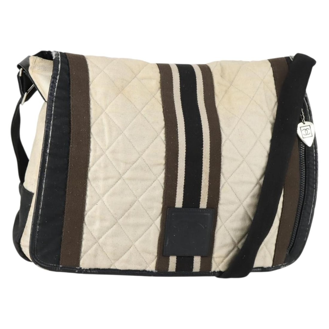 Beige and Silver Canvas CHANEL Sports Line Shoulder Bag from Italy: Beige and Silver Canvas CHANEL Sports Line Shoulder Bag from Italy This is a CHANEL Sports Line shoulder bag crafted from beige and silver canvas. Made in Italy, the bag features a spacious interior a