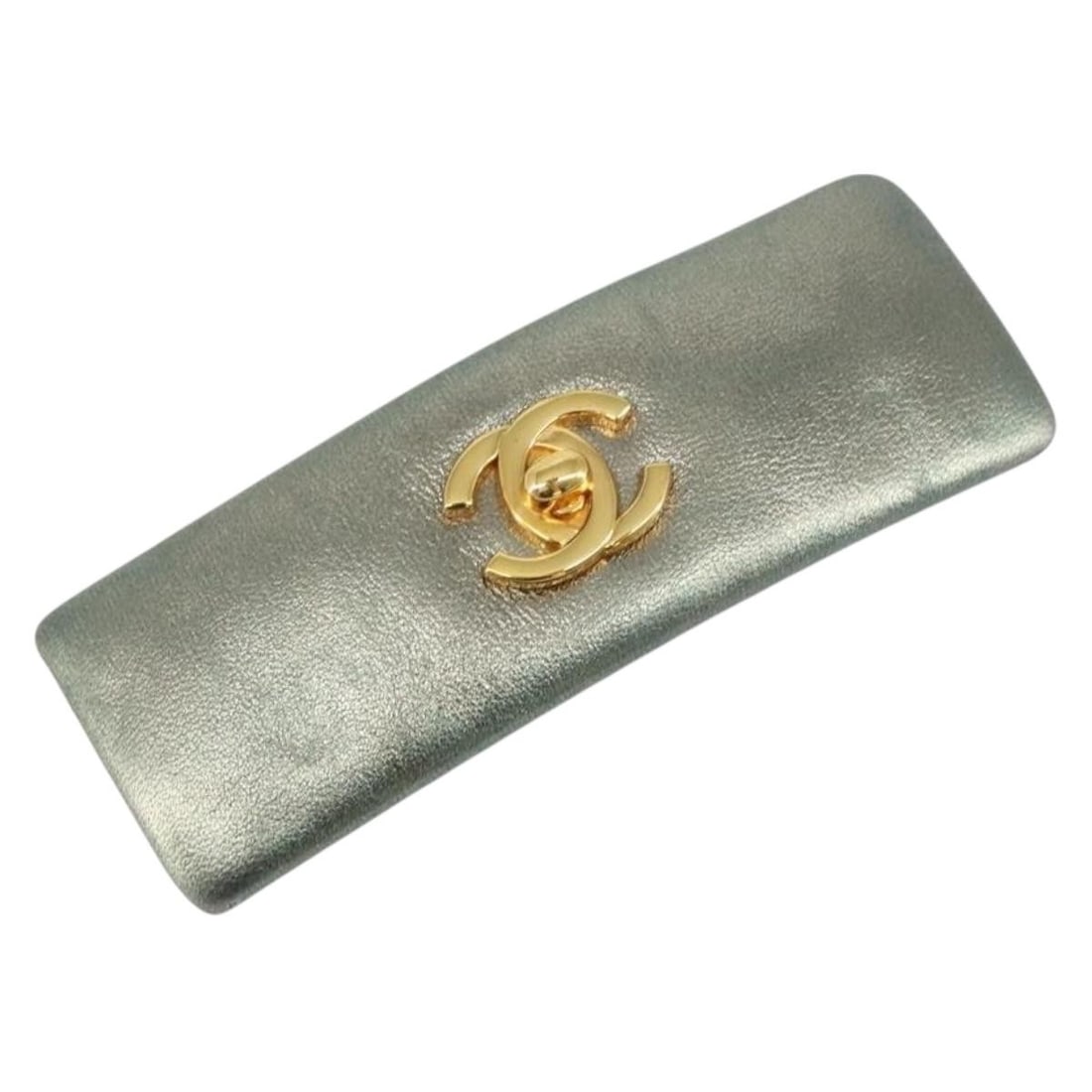 Turquoise Blue Lambskin CC Logo Hair Accessory by CHANEL: Turquoise Blue Lambskin CC Logo Hair Accessory by CHANEL This CHANEL hairpin features the iconic COCO Mark design and is crafted from turquoise blue lambskin leather. Made in France, the accessory dis