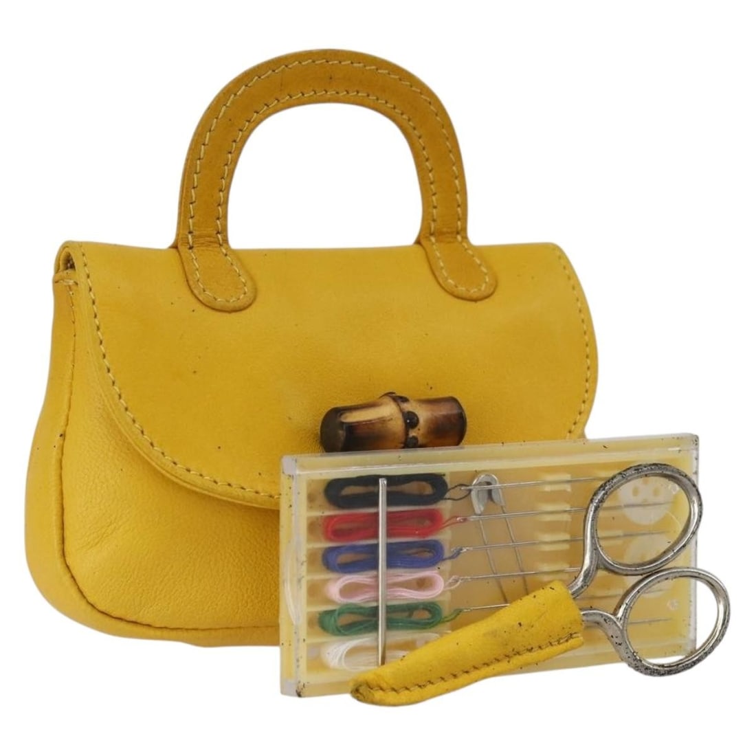 GUCCI Yellow Leather Bamboo Sewing Set Pouch Italy: GUCCI Yellow Leather Bamboo Sewing Set Pouch Italy This authentic Gucci Bamboo Sewing Set Pouch is crafted from high-quality yellow leather, showcasing a stylish yet functional design. Made in Italy,