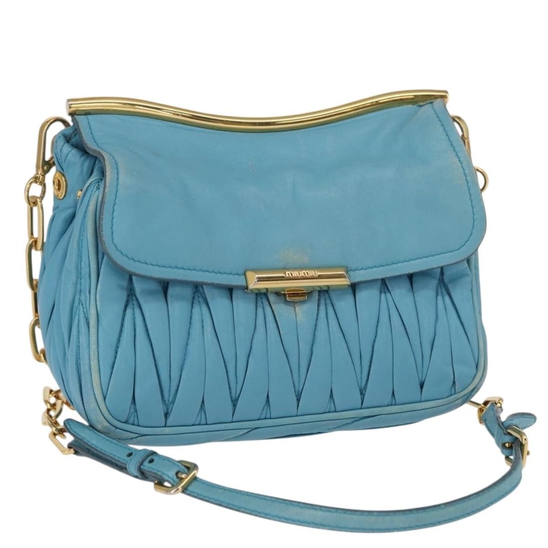Blue and Gold Leather Shoulder Bag by Miu Miu with Chain Strap: Blue and Gold Leather Shoulder Bag by Miu Miu with Chain Strap This Miu Miu chain shoulder bag features a blue and gold leather exterior with a chain shoulder strap. The bag is heavily used, showing s