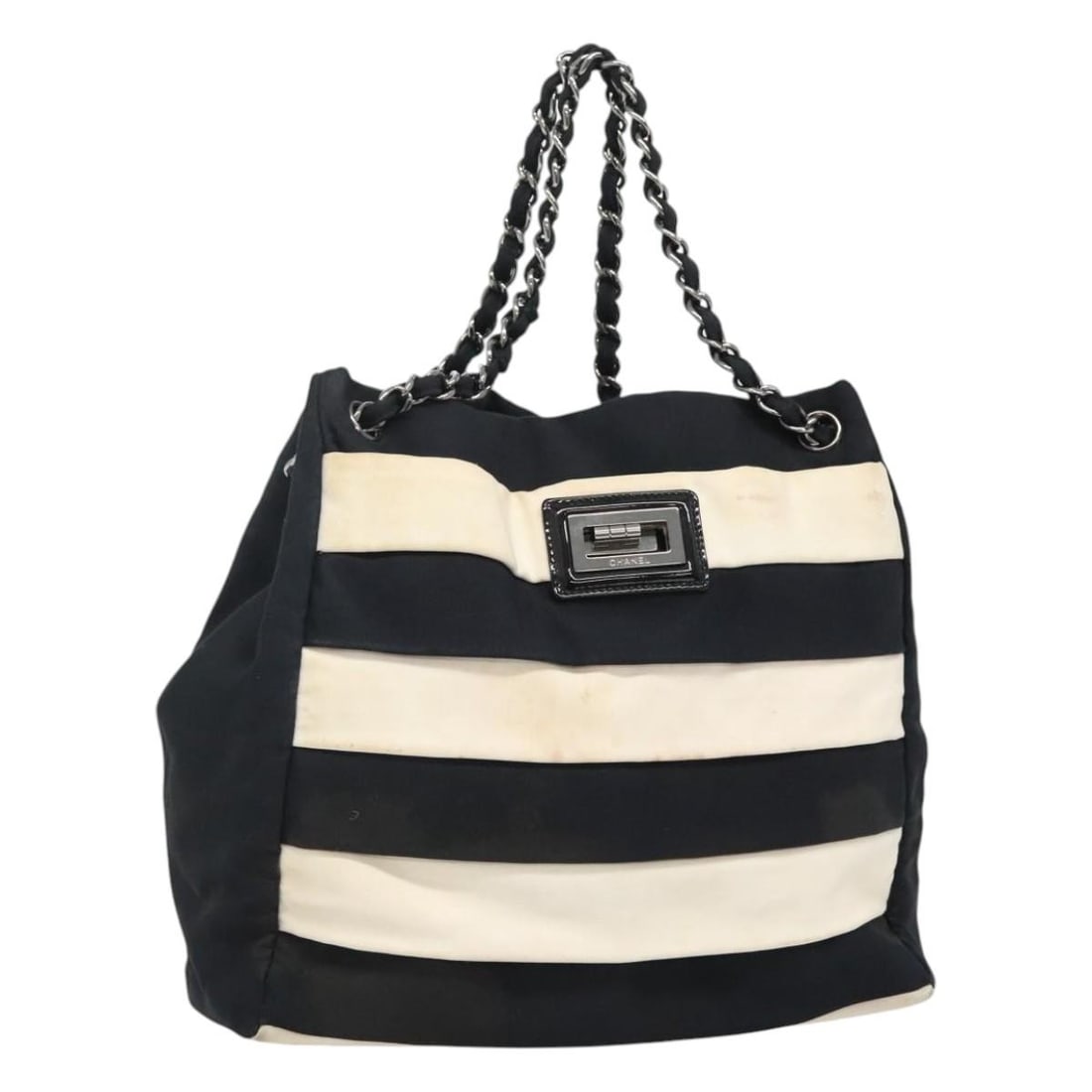 CHANEL Navy White Canvas Chain Tote Bag Made in Italy: CHANEL Navy White Canvas Chain Tote Bag Made in Italy This authentic CHANEL Chain Tote Bag is crafted from durable canvas in a stylish navy and white color combination. The tote features a spacious de