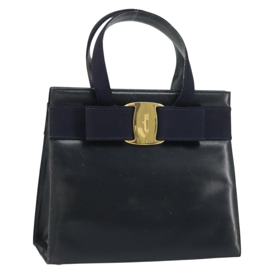 Salvatore Ferragamo Vala Leather Hand Bag Navy Gold Auth BA214178: Salvatore Ferragamo Vala Leather Hand Bag Navy Gold Auth BA214178 This Salvatore Ferragamo Vala Hand Bag is a luxurious accessory crafted from high-quality leather in a sophisticated navy and gold col